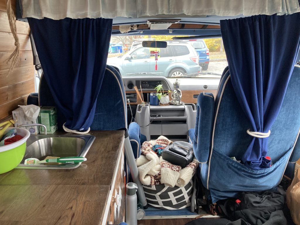 stealth camping blackout curtains dark blue inside van 