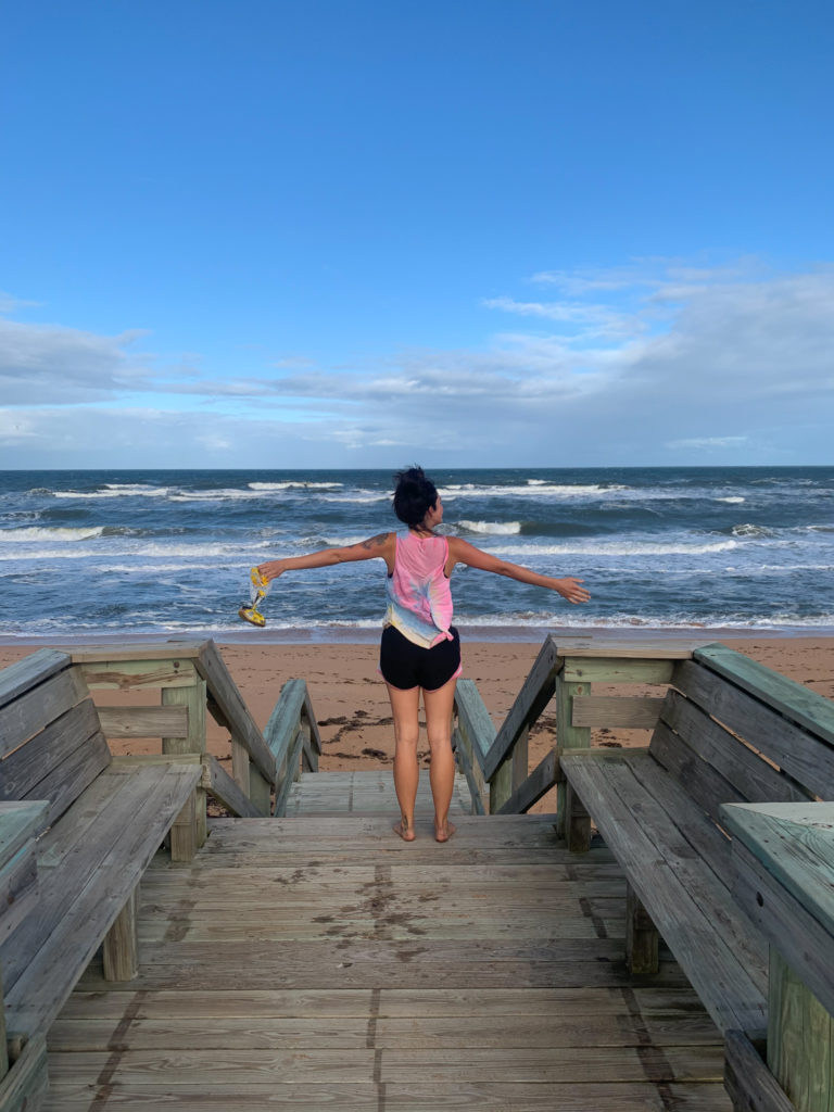Florida road trip. Standing on a boardwalk by beach 