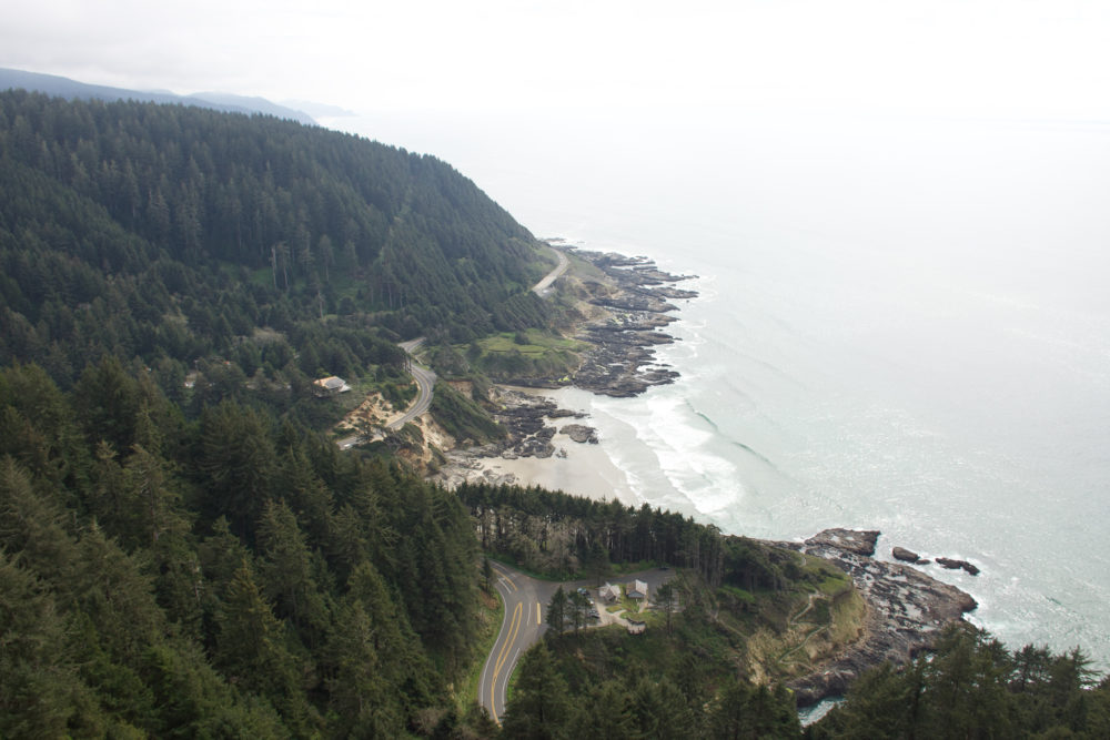 View of curving roadway winding along the coastline. 