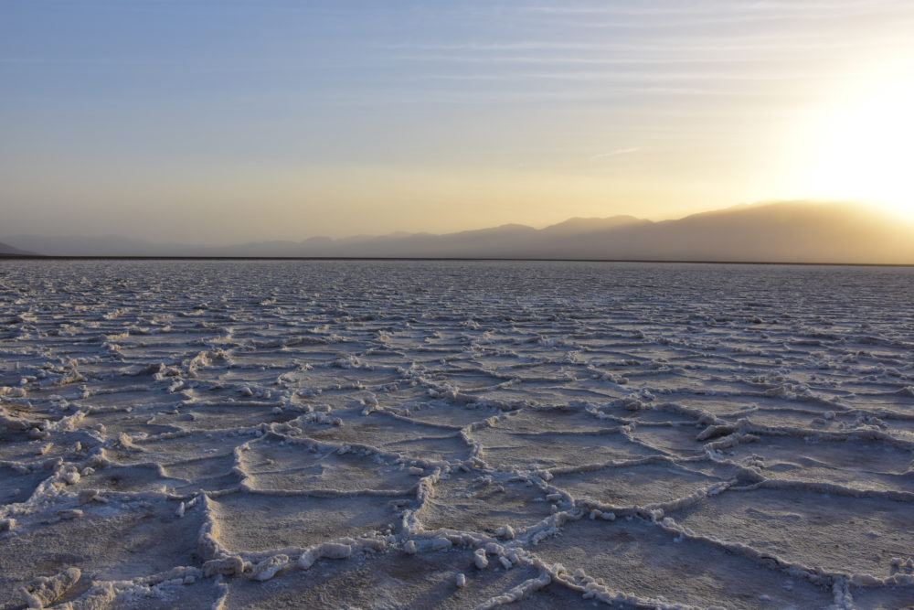 view of the sunset at the salt flats in death valley 