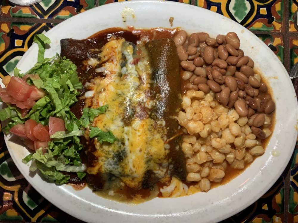 enchiladas and sides at a nice restaurant. 