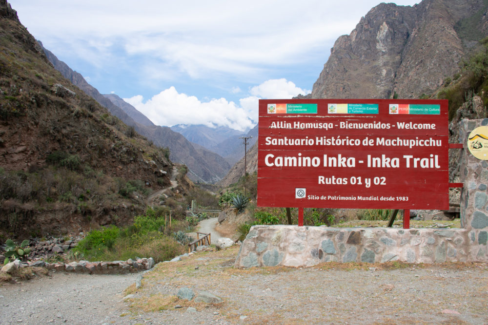 The very beginning of the traditional Inca trail trek. The sign and the trail are visible. 
