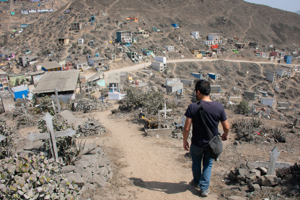 The second largest cemetery in the world. Our guide walking us down a path. 