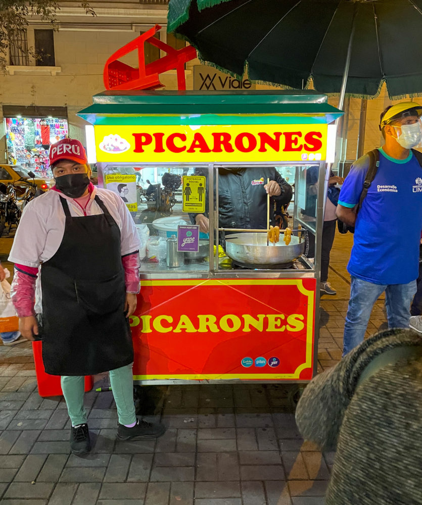 A colorful street food stand serving Peruvian street food. 
