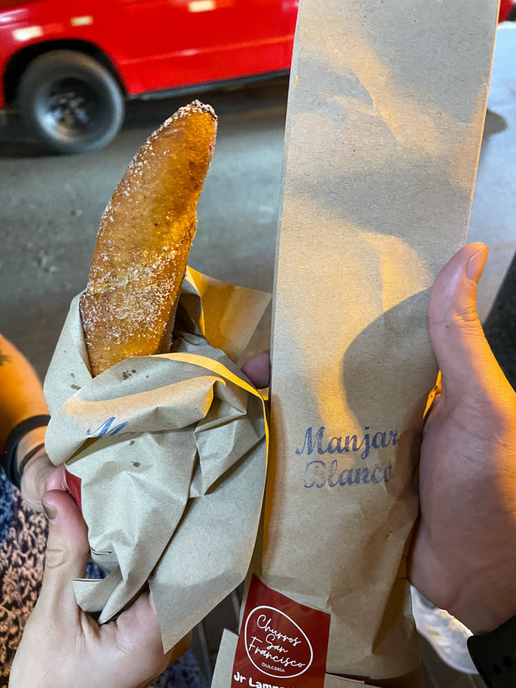 churro in a brown paper bag. 