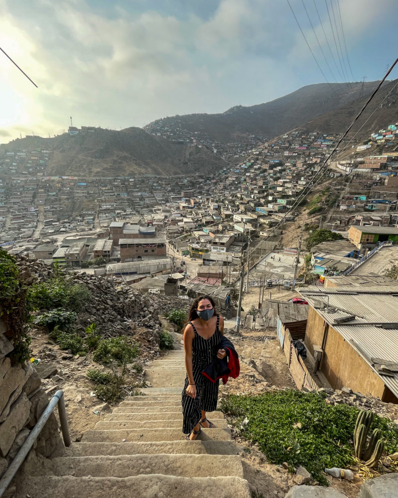 Me standing on the staircase overlooking the human settlements on our tour of lima. 