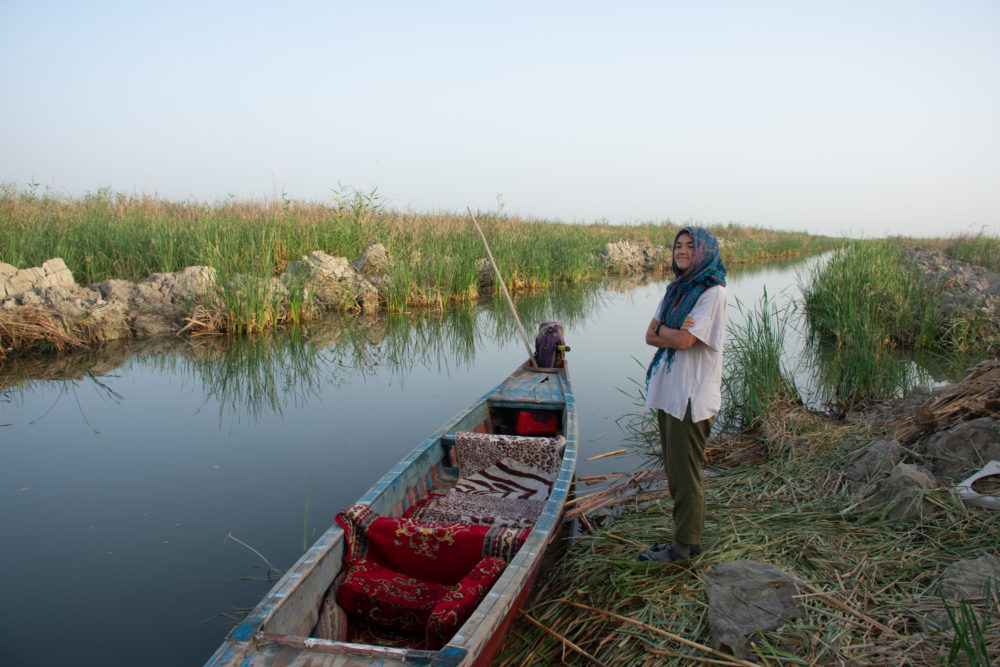 standing in the Mesopotamian marshes. Iraq travel tips 