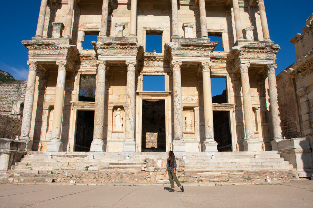 Woman standing in front of the roman ruins. Turkey's Turquoise Coast