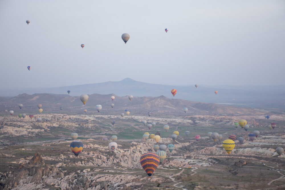Hot air balloons flying over cappadocia. 