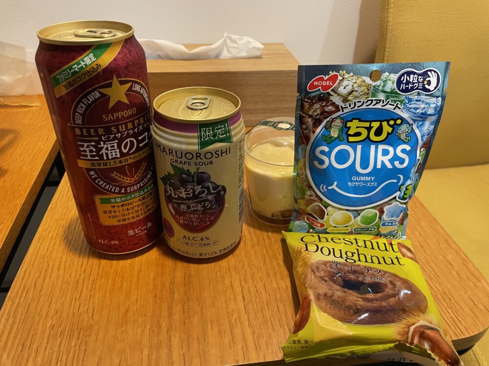 a variety of snacks from a japanese convenience store. 