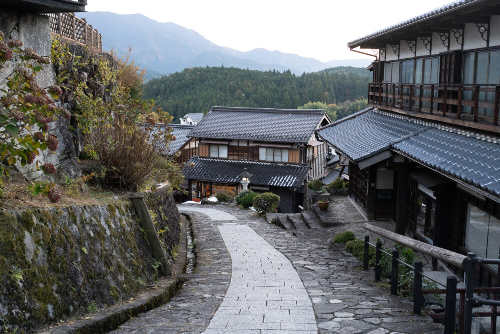 Magome to Tsumago. The town streets of Magome. Cobblestone bath with old school buildings. 