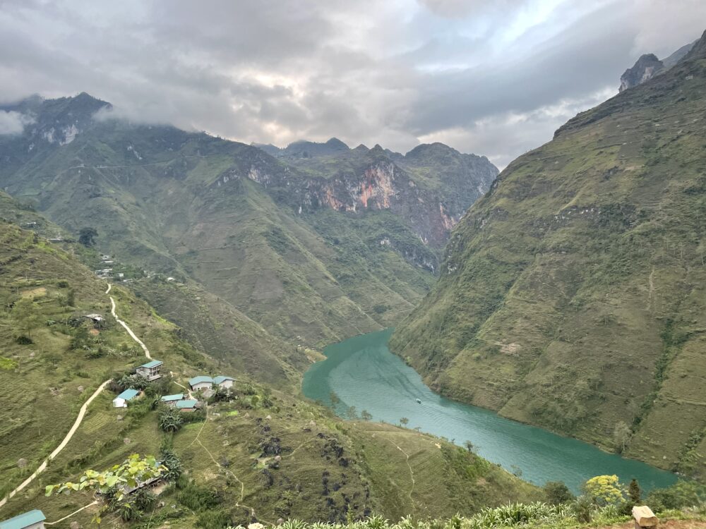 View on the Ha Giang portion of the North Vietnam motorbike loop. Blue river in a green canyon. 