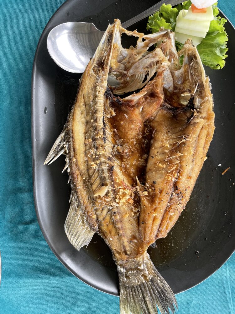 A giant fried fish ready for eating. 