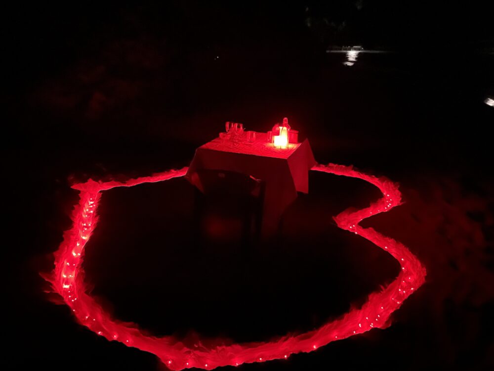 Dinner on the beach with a heart in the sand. 