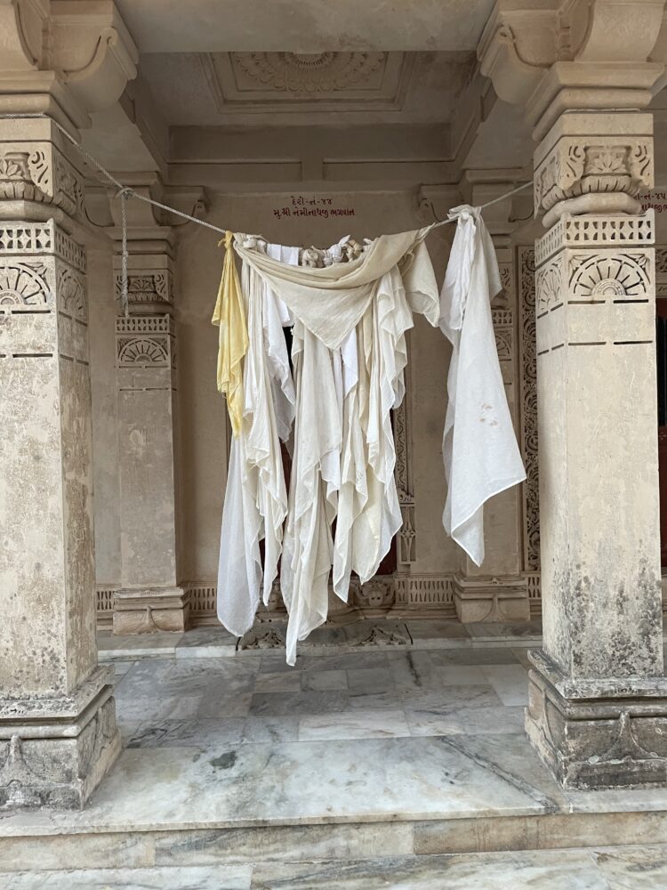 Jain white robes hanging up to dry. 
