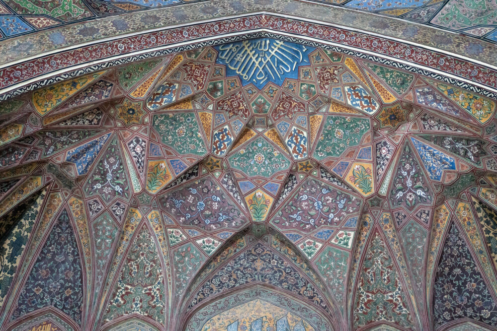 The ornate ceiling of a mosque with colors of blue and green. Wagah Border Crossing 
