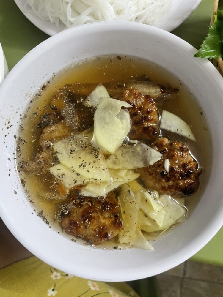 pork balls and bamboo served in broth. 