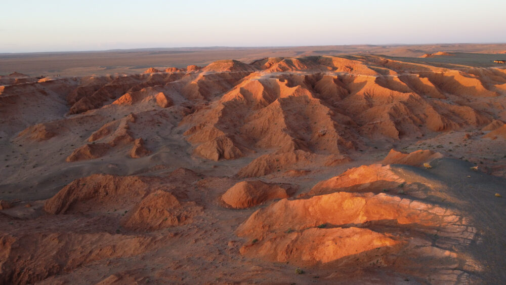 view from above of the orange ridges of the flaming cliffs in Mongolia 