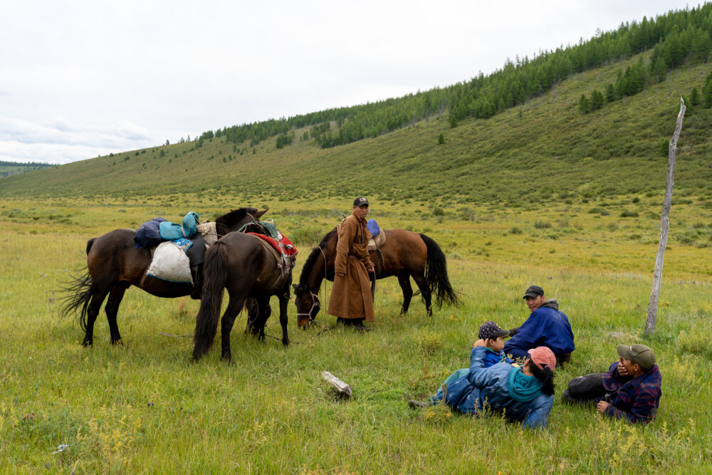 horses and tribe members in the tundra