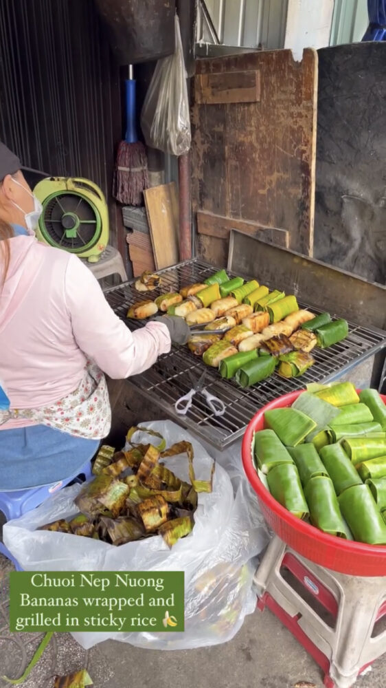 Grilled bananas wrapped in banana leaf being cooked 