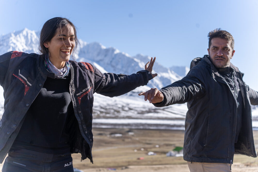 Our two guides teaching us dance moves at Shandur Pass. 