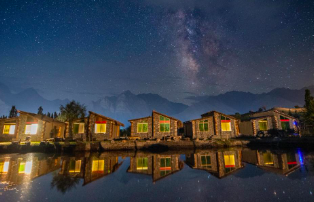 Skardu hotel by a lake with stars overhead