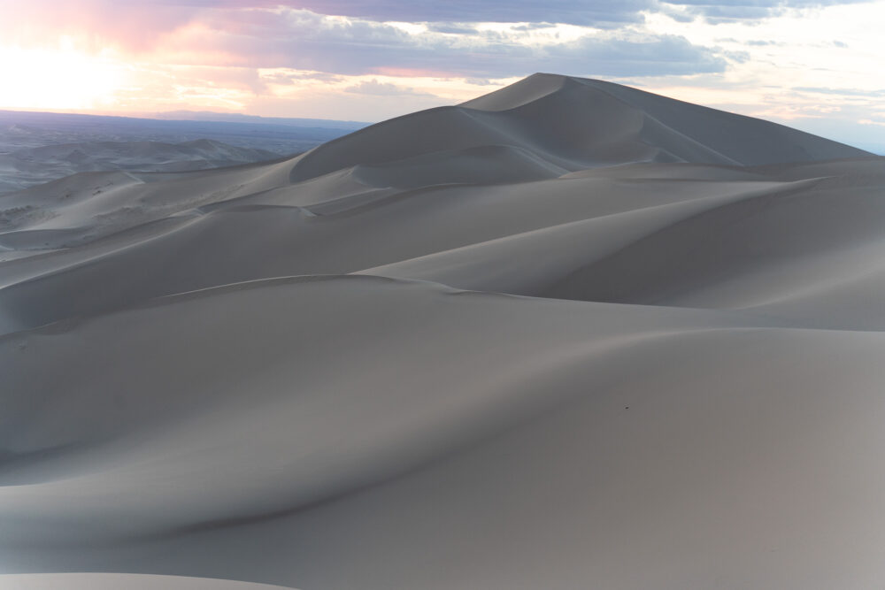 Huge sand dunes with a sunset 