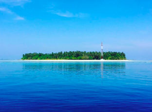 view of omadhoo island from the water 