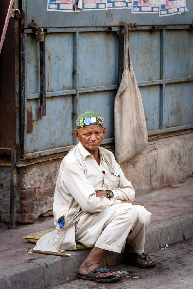 Man sitting on the curb in Pakistan 
