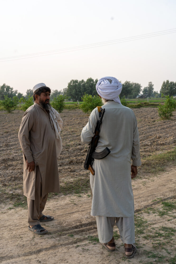 Two men wearing guns in Pakistan