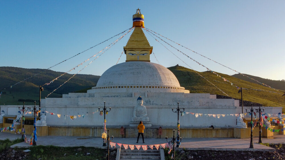 Monastery views. A white dome with buddhist gold eyes on top. self drive Mongolia itinerary