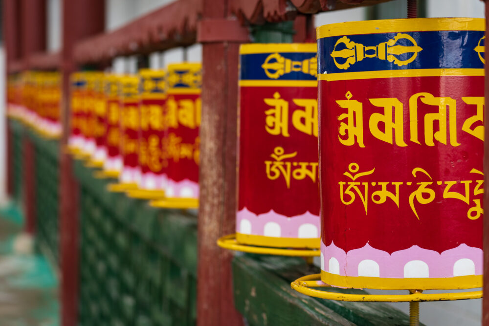 Close up of the red and green buddhist prayer tubes 