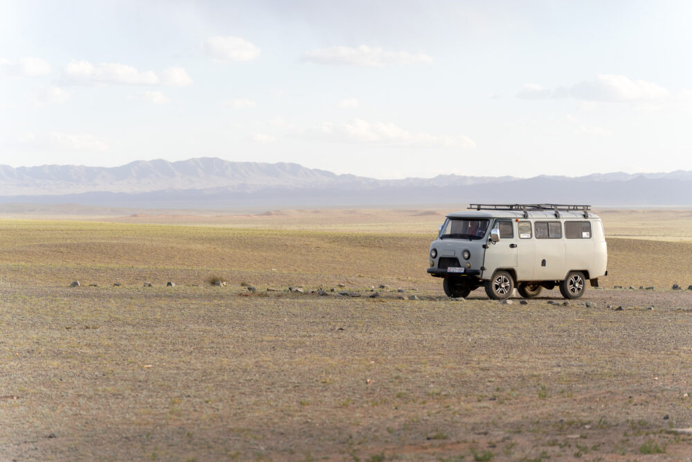 a russian van in a wide open mongolia landscape 