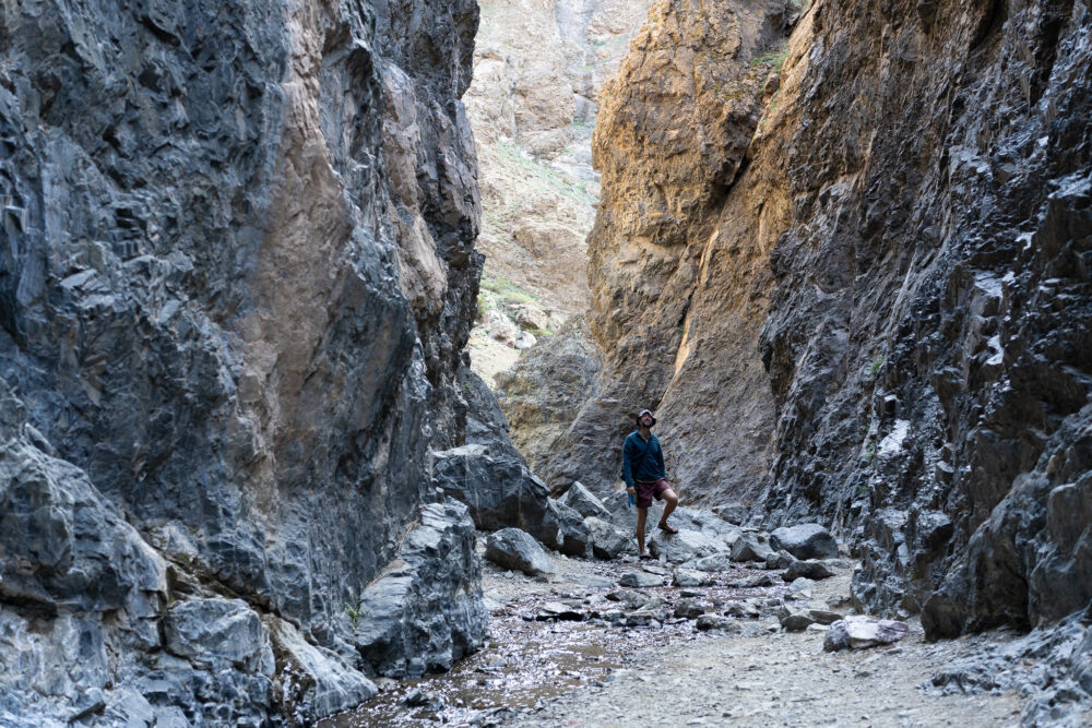 Evan walking through a canyon in Yolyn Am Valley 