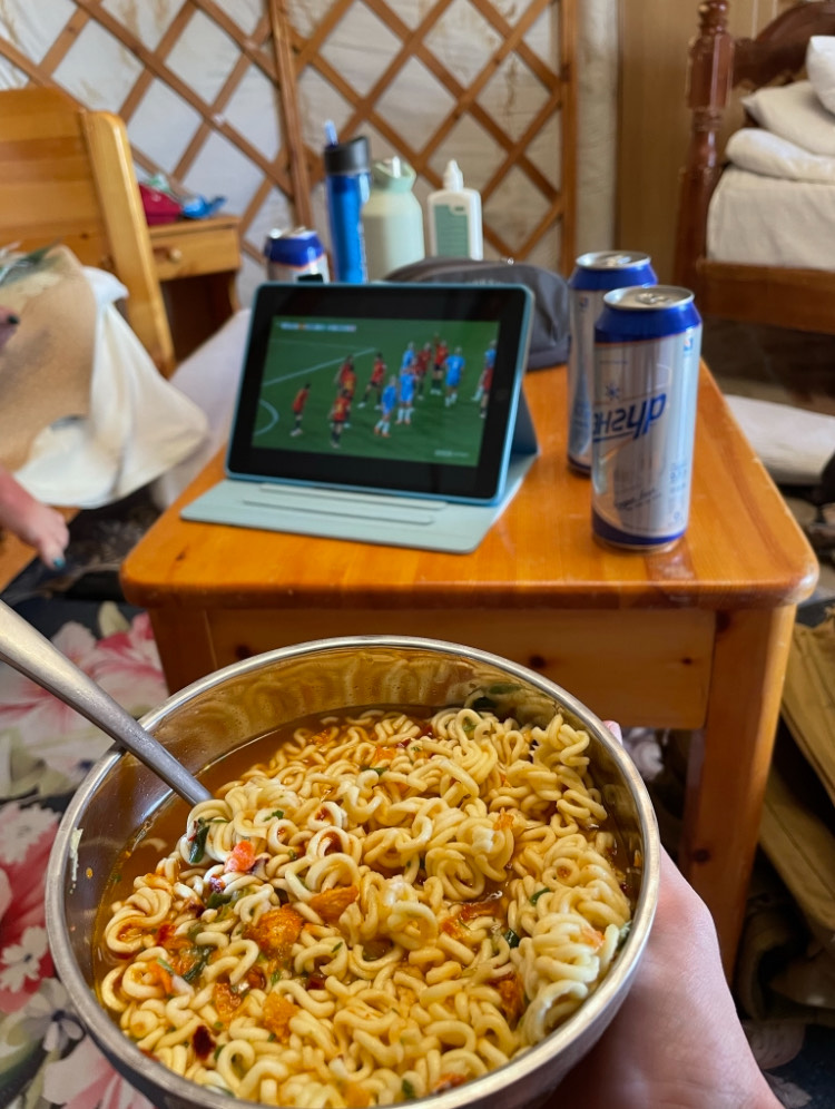 Bowl of instant ramen eaten while watching soccer. 