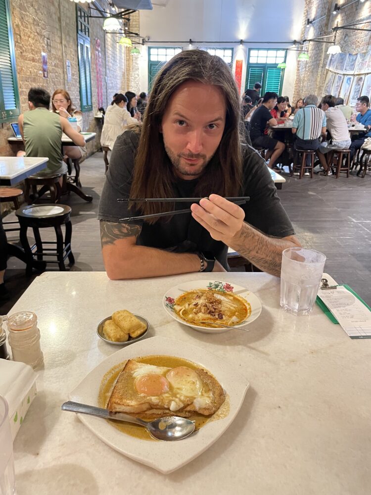 Evan eating his malaysian meal 