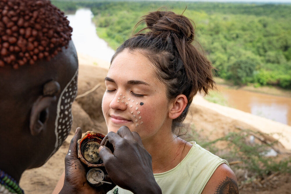 me, getting my face painted by one of the tribal woman in Ethiopia