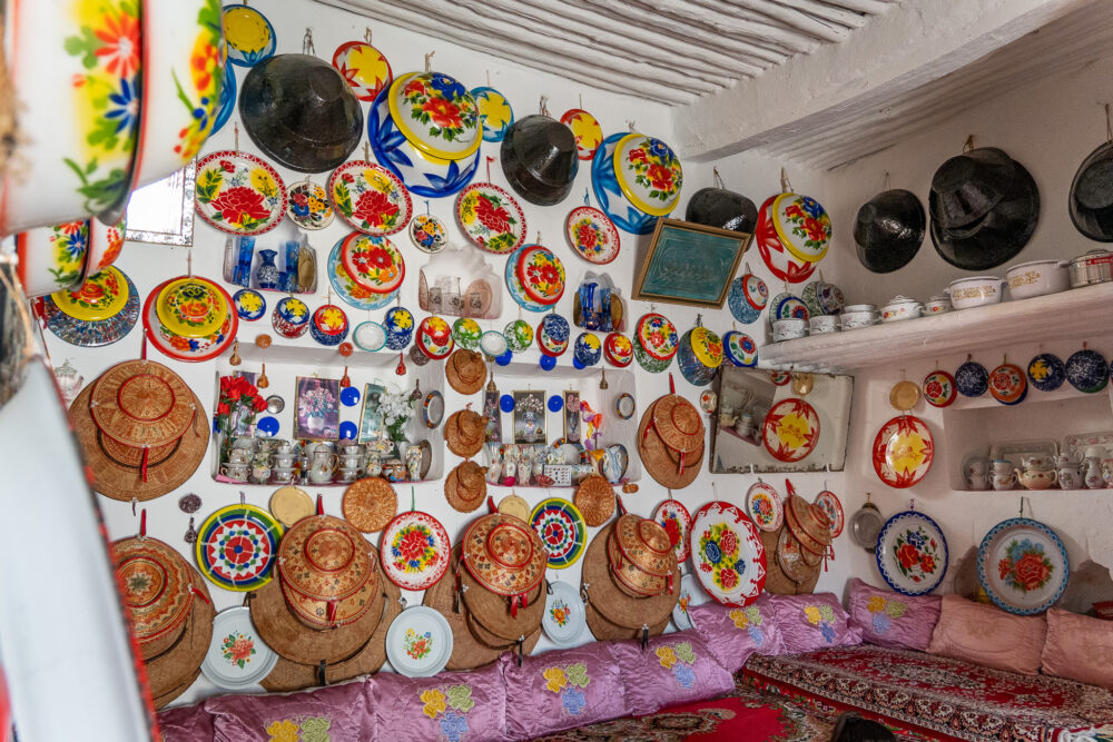 the wall inside a harar guesthouse covered in colorful pottery. one of our favorite homestays while Backpacking in Ethiopia 