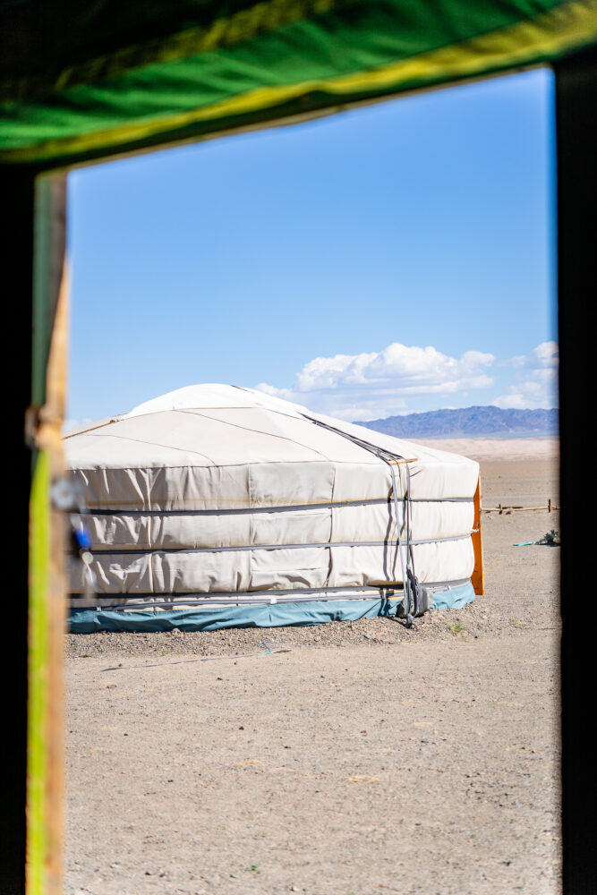 A mongolia ger viewed through a doorway