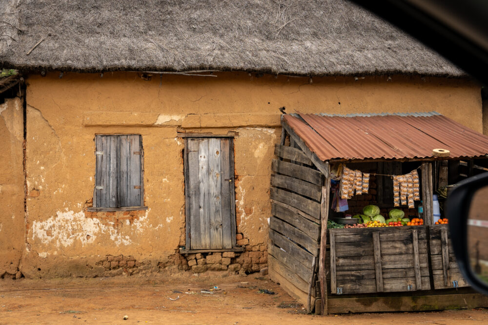 mud-style homes on the road side in Madagascar