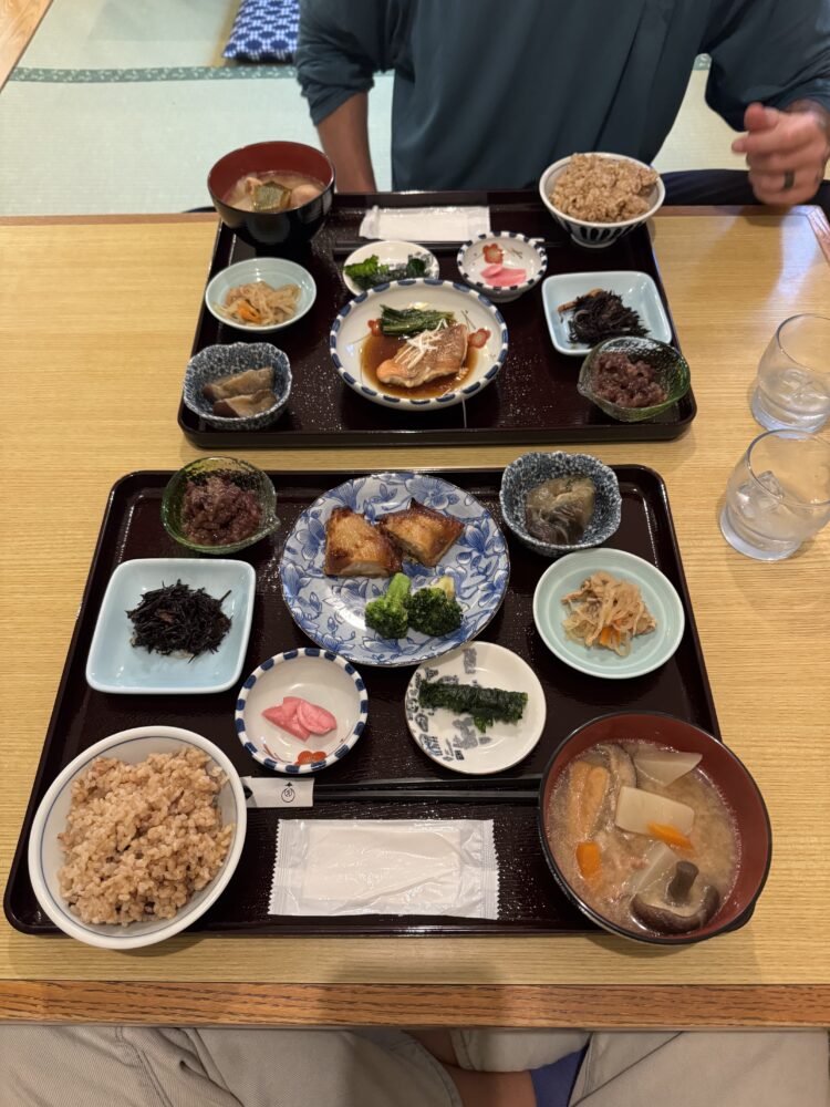 A Japanese meal served in numerous small plates and bowls 