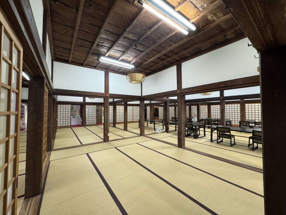 A large tatami mat dining area inside a ryokan 