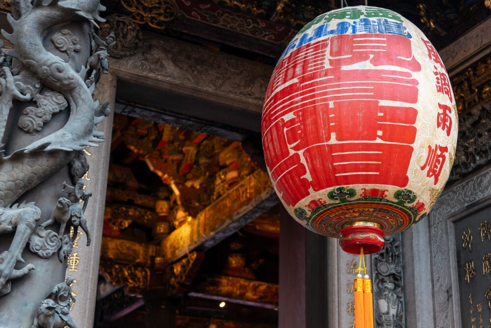 painted lantern hanging in front of a Taiwan temple 